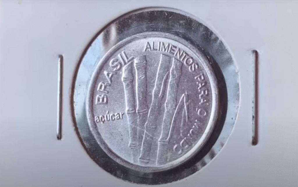  Anverso da moeda de 1 Cruzeiro FAO 1985 com desenho da cana-de-açúcar